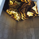Tiger Onyx Bolder Stone Panel installed as a backlit shower ceiling