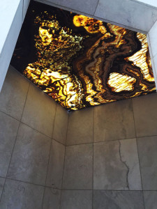 Tiger Onyx Bolder Stone Panel installed as a backlit shower ceiling