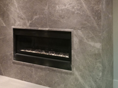 Silver Shadow Bolder Panel installed on a fireplace