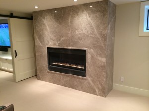 Silver Shadow Fireplace with floor to ceiling paneling and matching moulding